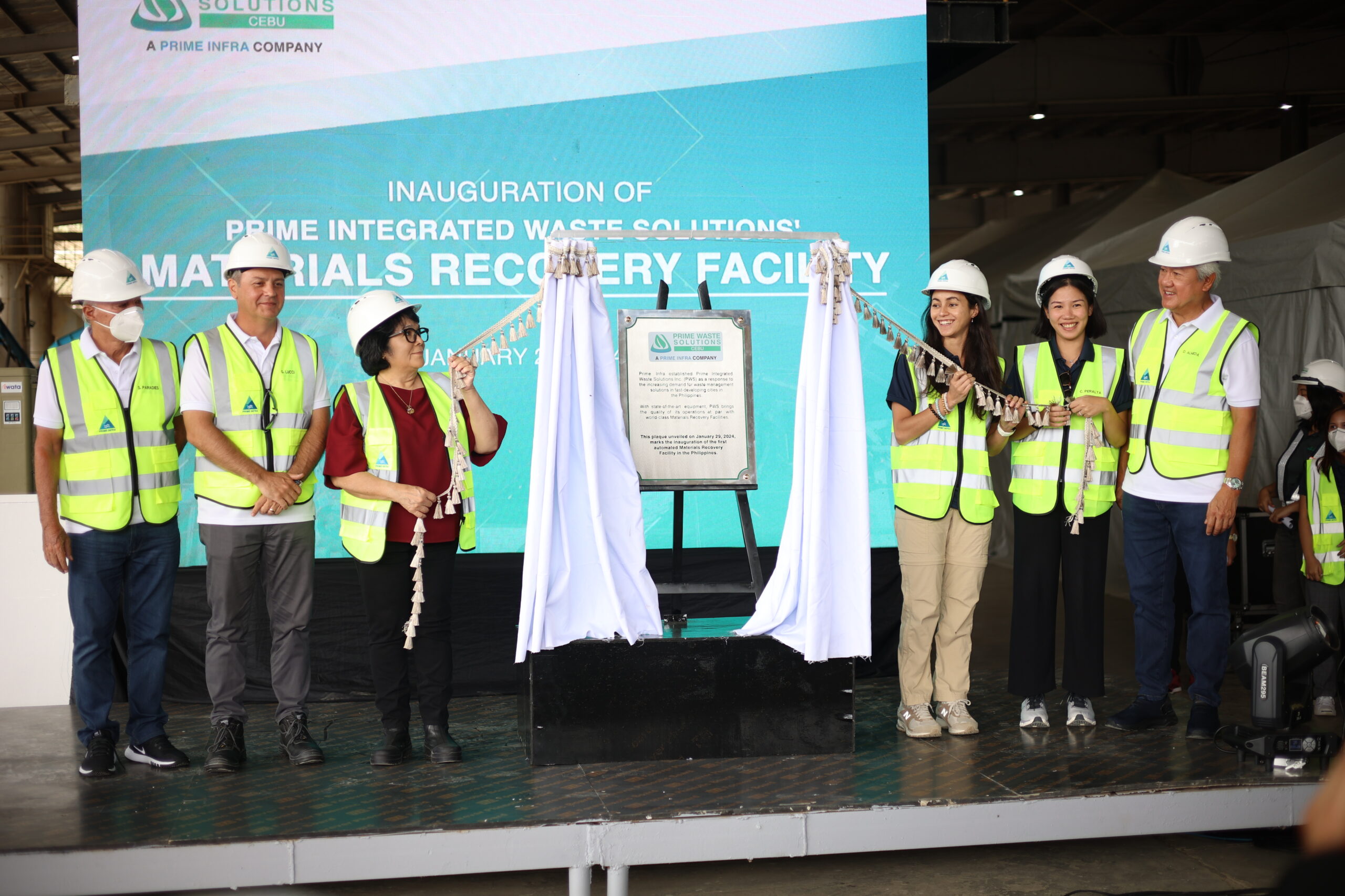 L-R: Director Steve Paradies and President and CEO Guillaume Lucci of Prime Infra, DENR Secretary Ma. Antonia Yulo-Loyzaga, PWS Chair Katrina Razon, and Market Sector Lead for Waste Cara Peralta and Donato Almeda of Prime Infra unveil the plaque at the inauguration of Prime Integrated Waste Solutions’ first Materials Recovery Facility in Cebu.